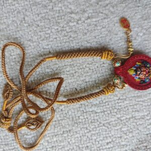 XSP008	Vermilion-Toned Yellow Jambhala-Inspired Decorative Plaque